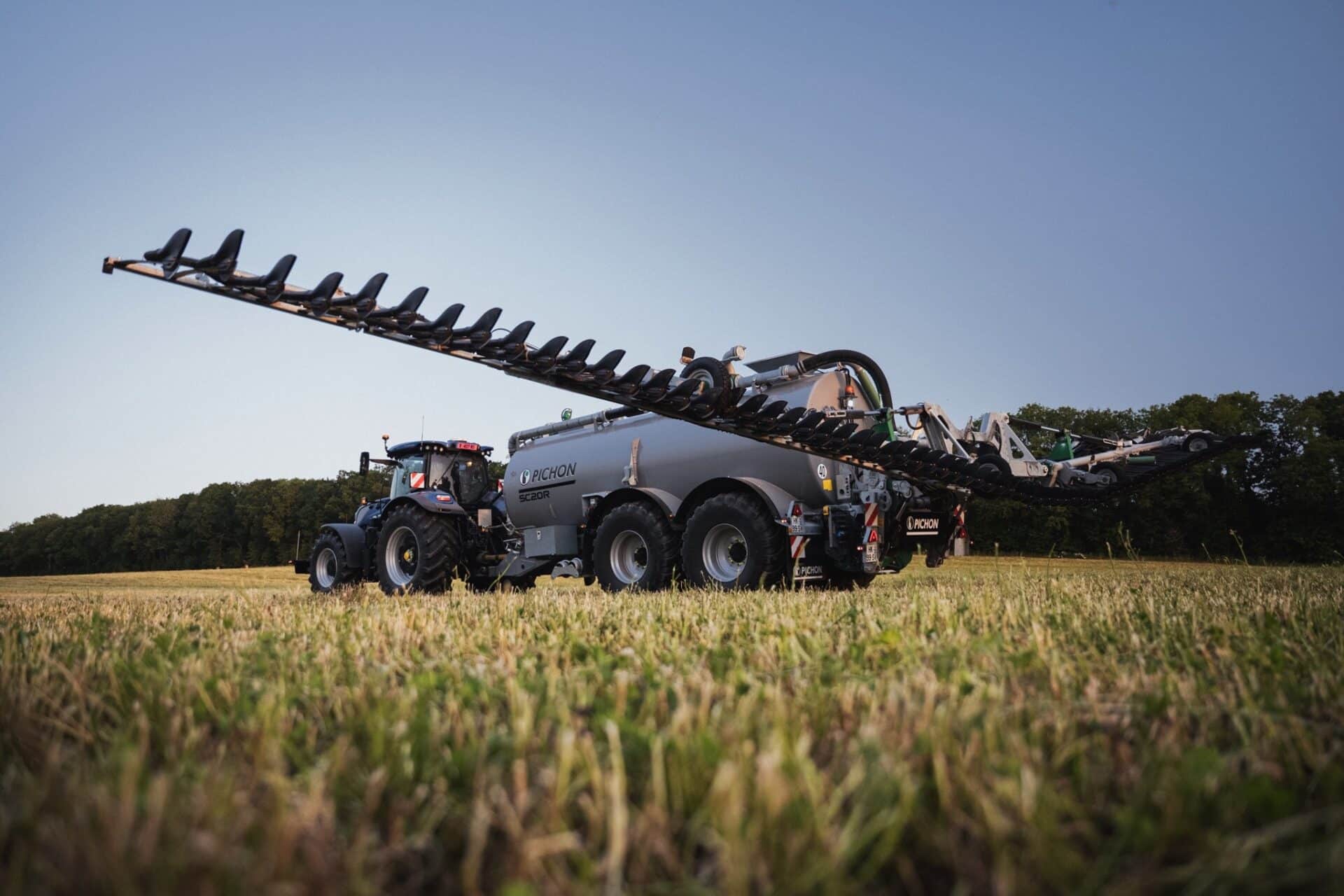 Pichon SC20R slurry tanker with its applicator booms fully extended at dusk